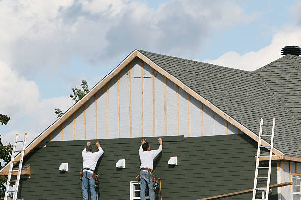 Professional Vinyl Siding technician working in Towson, MD